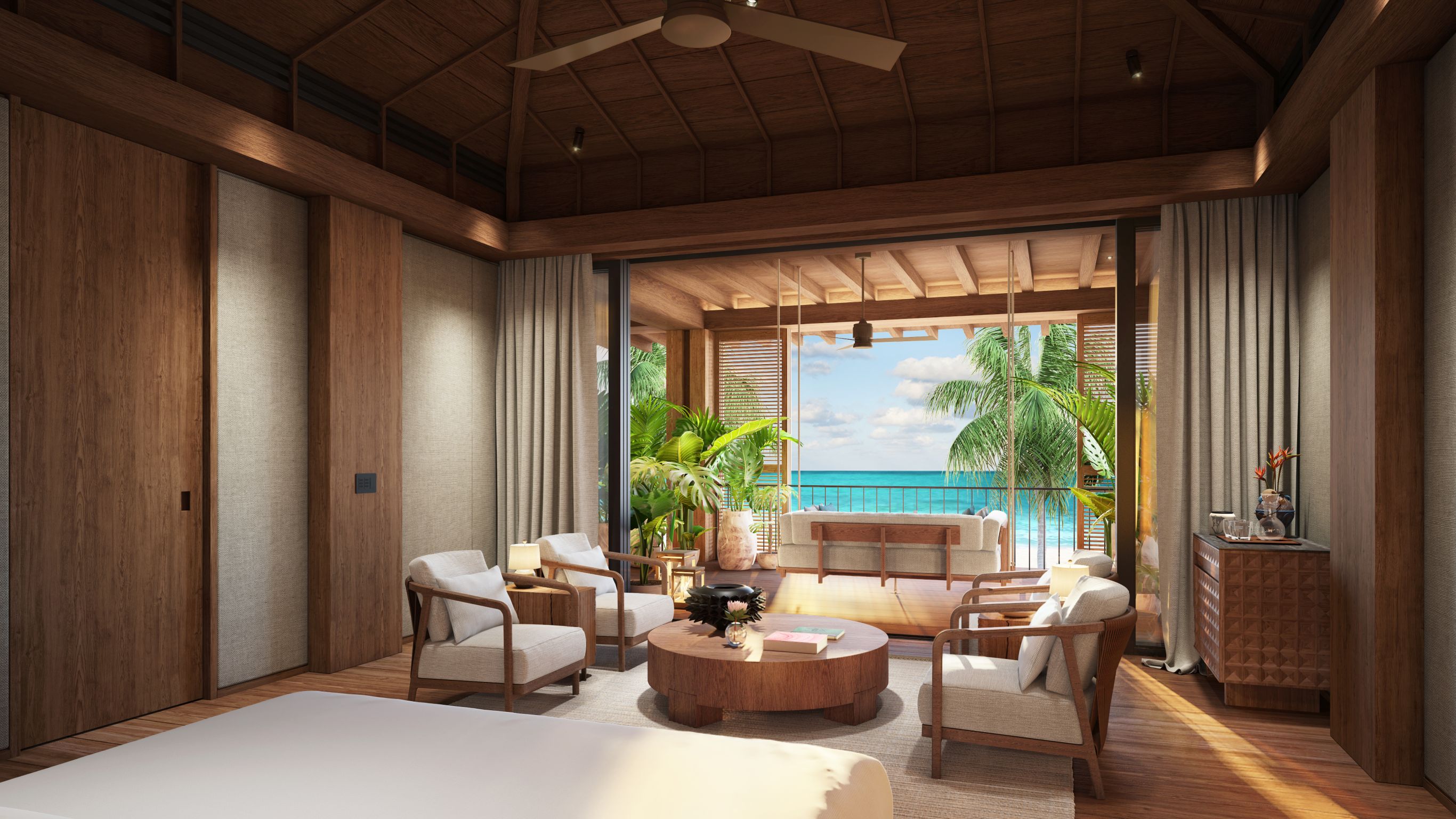 Beachfront Villa_Rendering_Second Master Bedroom with king bed and sitting area view looking out onto private terrace overlooking beach and sea